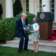 Image for article titled Maybe If Someone Showed Melania a Picture of Michelle Obama in a Mask She'd Copy Her and Keep Hers On